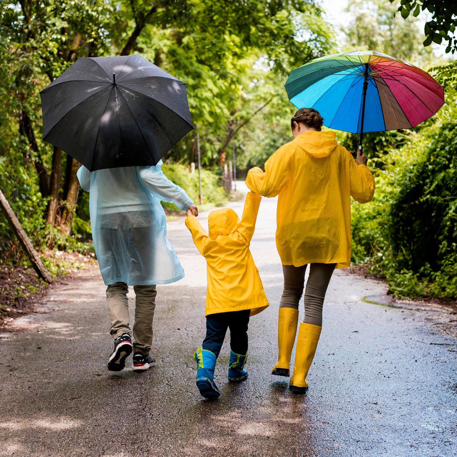 family-taking-walk-rain